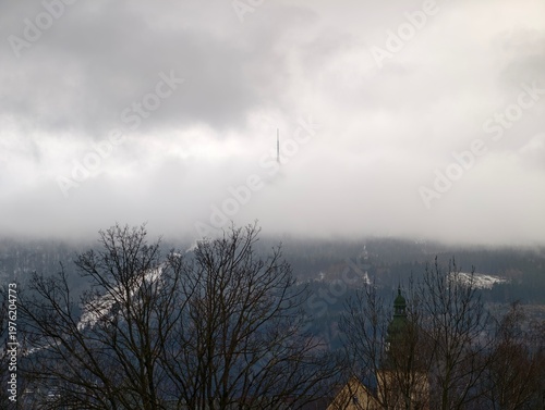 Фотография Hazy mountain peaks with surrounding trees
