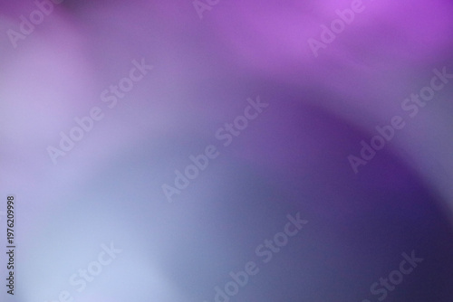 Colorful purple gradient background with glowing bokeh and flowing light waves