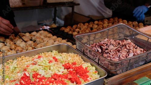 Freshly Prepared Authentic Japanese Takoyaki Street Food Cooking with Delicious Ingredients
