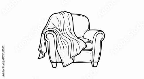 Cozy armchair with a draped blanket, ready for relaxation