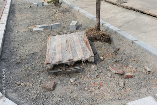 Wallpaper Mural Exposed Tree Pit With Pallet And Loose Gravel, Curb Stones And Scattered Bricks, Site Preparation For Planting And Root Protection, Municipal Landscaping Scenario, Suggests Landscaper Crew Action Torontodigital.ca