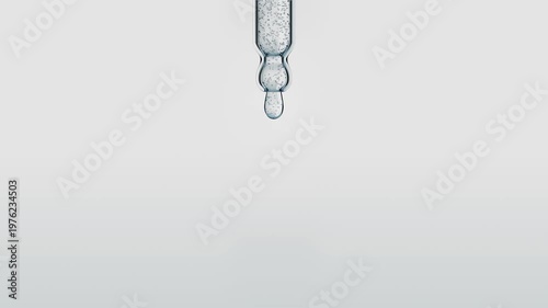 Macro shot of a transparent serum drop falling from a glass pipette. Liquid cosmetic product with air bubbles on a white background. Beauty and skincare concept. 3d animation