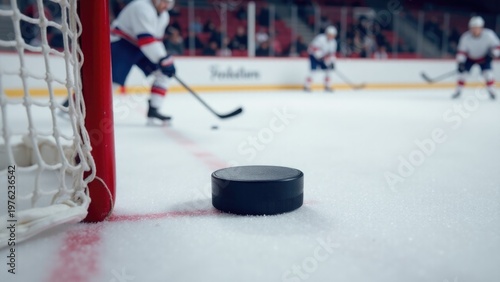 A hockey puck resting on the surface of an icy rink, perfect for use in sports-related designs