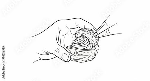 Hand piping frosting onto a pastry with intricate details