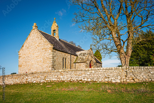 West side of St Oswald's Church at Heavenfield, a historic hilltop chapel in Northumberland, situated along Hadrian's Wall Path, at the spot where King Oswald is said to have raised a wooden cross