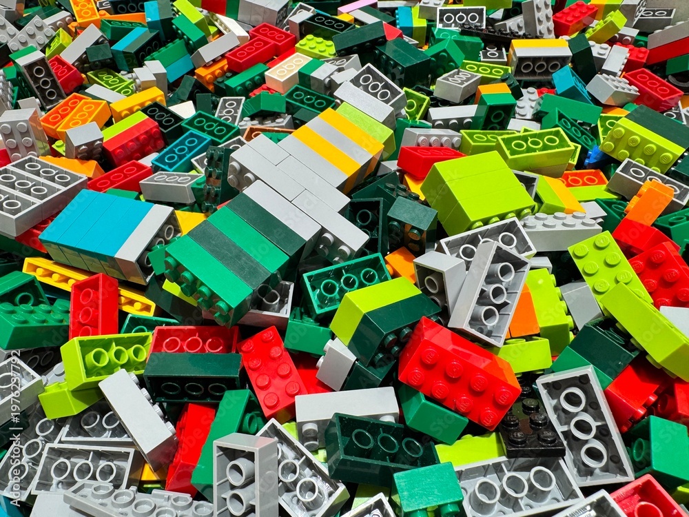 Fototapeta premium Bangkok Thailand, April 13, 2026: A close-up of a large pile of colorful Lego bricks in a child's toy storage box.
