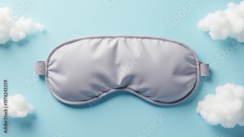 Wallpaper Mural A sleeping mask on a soft blue background with fluffy white clouds, perfect for bedroom or relaxation scenes Torontodigital.ca