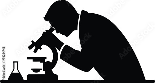 Scientist intently examining a specimen under a microscope in a lab setting