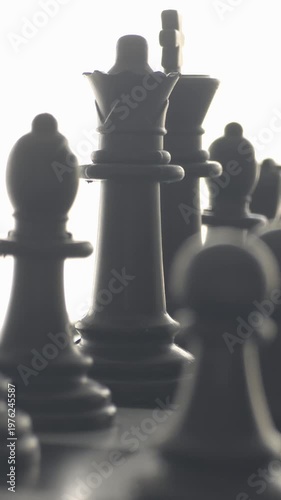 Dark silhouettes of chess pieces for mystery and power concept