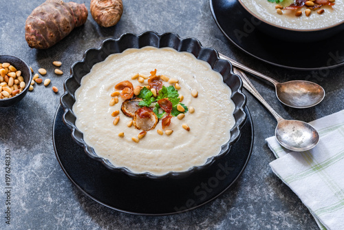 Картината върху платно Roasted Jerusalem Artichoke soup with crispy parma ham and pine nuts garnish