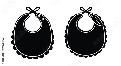 Two black baby bibs with decorative edges on transparent background silhouette