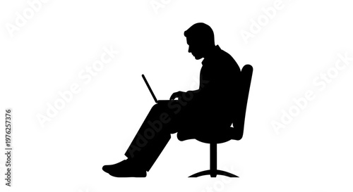 Silhouette of a Man Working on a Laptop While Sitting on a Chair