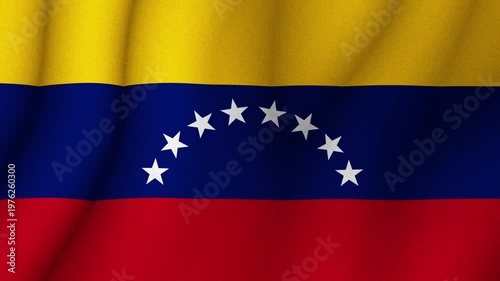Flag of Venezuela waving in wind with yellow blue red stripes and stars. National identity patriotism and country symbol concept.