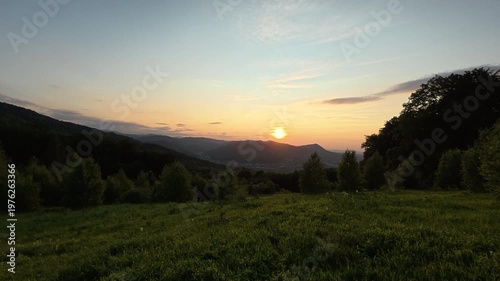 Beautiful mountains with warm sunset at spring or summer time. Mountain landscape sunrise. Mesmerizing and aweing nature, environment concept