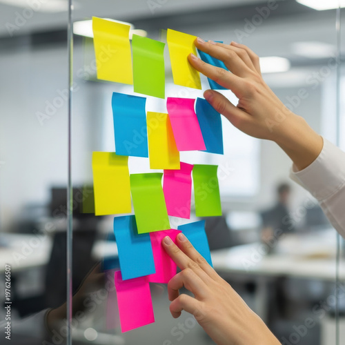 Wallpaper Mural Colorful sticky note planning office brainstorming hands placing sticky note on glass partition collaborative creative organization workflow Torontodigital.ca