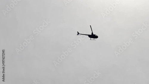 small helicopter flying around countryside