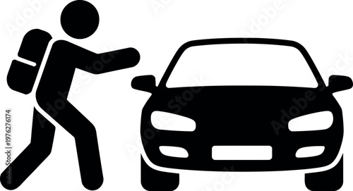 Person pushing a car with luggage in tow on a road