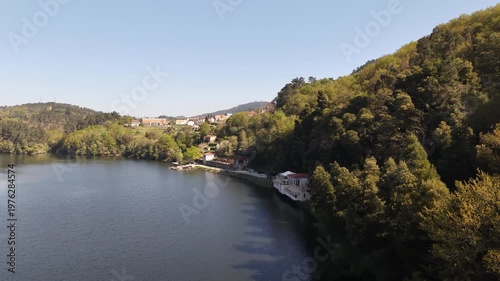 Balneario cortegada building by the river, offering health and relaxation in natural surroundings
