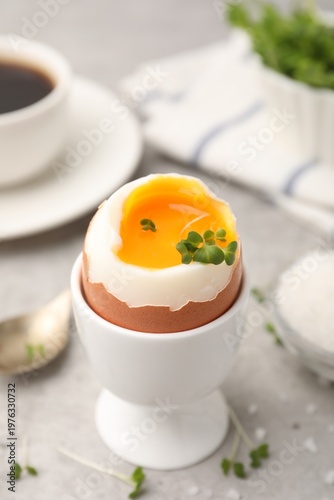 Принти на полотні Tasty breakfast with soft boiled egg, microgreens, salt and coffee on grey table