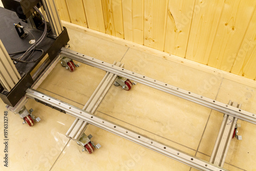 This item is a industrial castor wheel assembly mounted on an aluminum extrusion profile, commonly used in machinery frames or workstations. Industrial