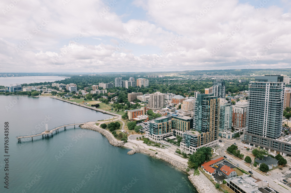 Obraz premium Skyline With Residential Towers Along Peaceful Maritime Promenade