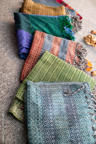 Rebozo massage and sound healing setup with Tibetan singing bowls, candles, yoga mats and traditional textiles, creating a calming wellness and holistic therapy atmosphere.
