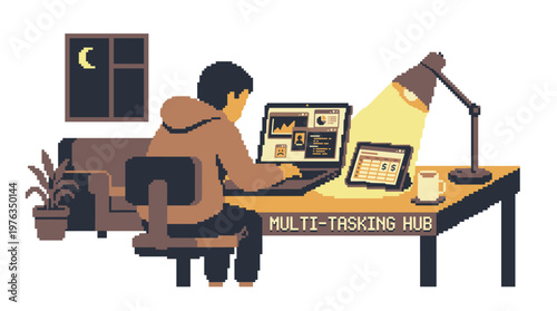 A focused individual in a cozy hoodie multitasks on a laptop and tablet at a wooden desk, warmly illuminated by a single lamp in a dark room at night.