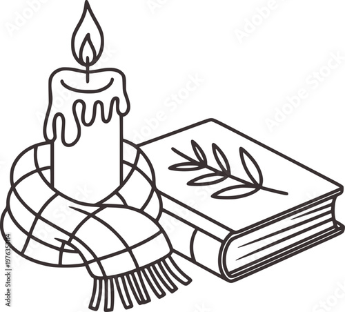 Cozy winter scene with lit candle wrapped in plaid scarf next to open book with leaf