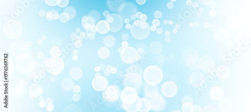 Light blue bokeh background with white blurry circles and light leak