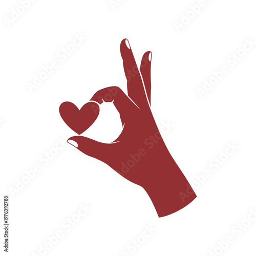 Woman's Hand Holding a Small Red Heart Shape with Okay Gesture During a Clear Day