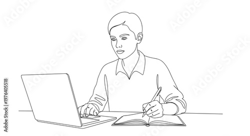 A focused young man diligently works on his laptop while simultaneously writing notes in a physical notebook, demonstrating multitasking and efficient study.