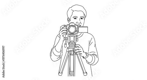 A serious young man is intently operating a camera mounted on a tripod, capturing a professional shot or video.