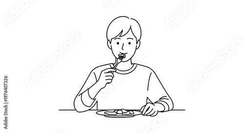 A young man is seated at a table, enjoying a meal by skillfully eating food from a plate with a fork.