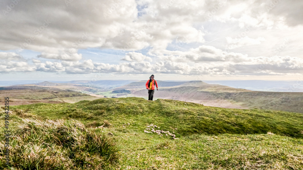 Obraz premium Backpack hiker in Beautiful landscape of Waun Fach, located at Brecon Beacons in Wales
