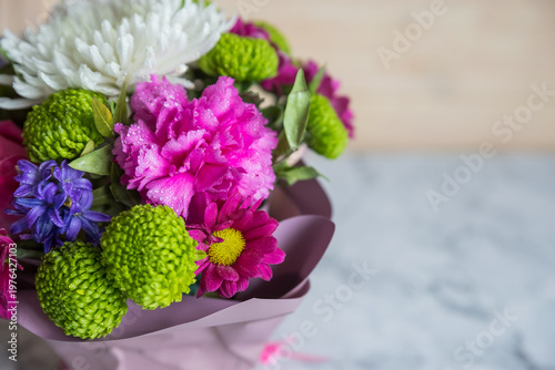 Absolutely gorgeous, multicoloured bouquet in a flower box on marble background.soft pastel floral composition for mother day celebration greeting and holiday. copy space