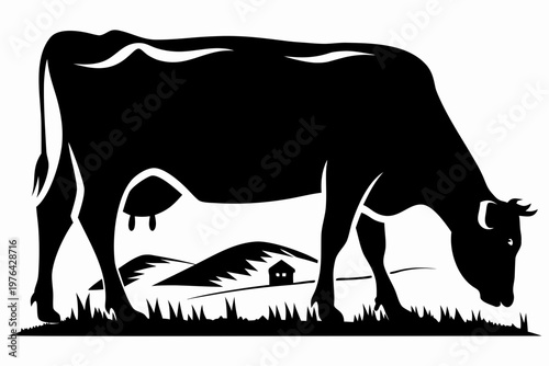 A black silhouette of a cow grazing in a rural landscape