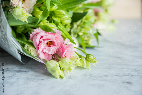 Celebrate special occasions with a colorful summer bouquet featuring fresh roses, eustoma blooms, creating an elegant and fragrant floral arrangement. love concept. copy space