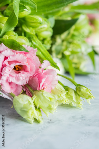 Celebrate special occasions with a colorful summer bouquet featuring fresh roses, eustoma blooms, creating an elegant and fragrant floral arrangement. love concept. copy space