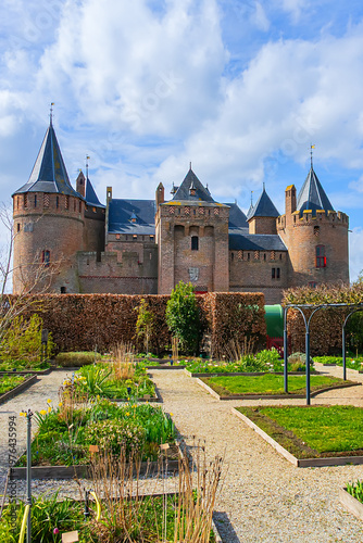 The medieval Castle Muiden (Muiderslot). Muiderslot was commissioned by Count Floris and completed in 1285. View of Muiden Castle from its gardens. Muiden, The Netherlands.