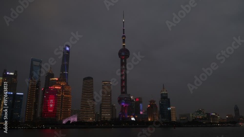 Pearl Tower Shanghai. Timelapse video of Shanghai iconic Oriental Pearl Tower in Lujiazui Pudong China with city lights moving cloud and urban traffic. Travel tourism and landmark city skyline concept