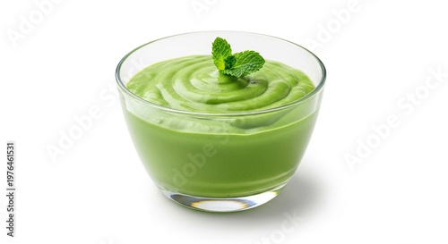 A smooth and airy mousse dessert made with vibrant green matcha powder and creamy avocado, served in an elegant glass bowl with mint, gourmet, culinary, vegan
