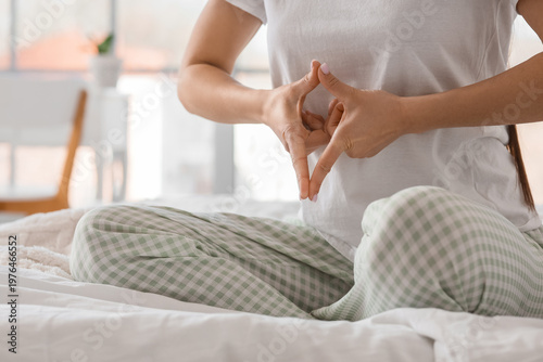 Young woman meditating in b...