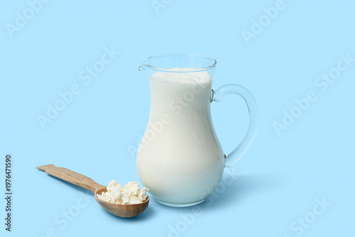 Jug of fresh kefir and wood...