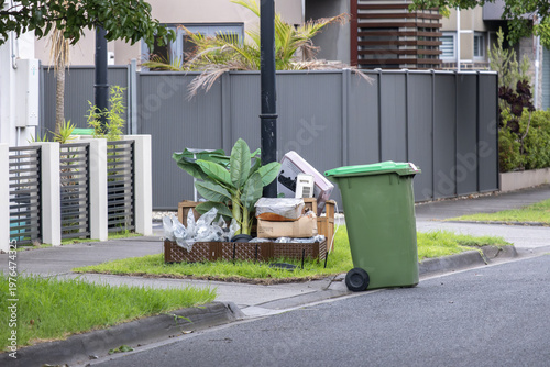 Принти на полотні Hard rubbish and green waste bin placed on suburban curbside in Australia