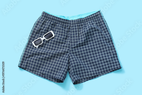 Swimming trunks with sungla...