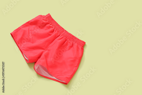 Swimming trunks on green ba...