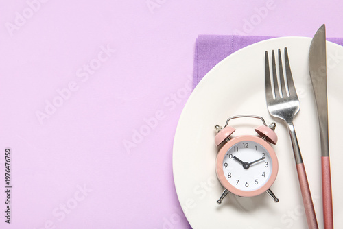 Plate with cutlery and alar...