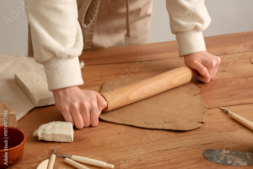 Young woman with rolling pi...