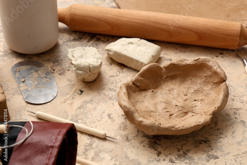 Clay plate and sculptor too...