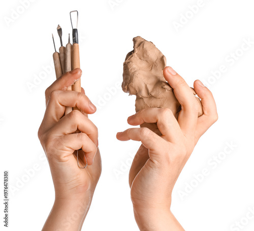Female hands with clay and ...